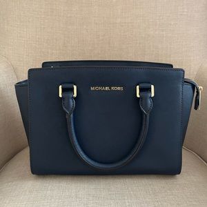Michael Kors crossbody convertible purse.